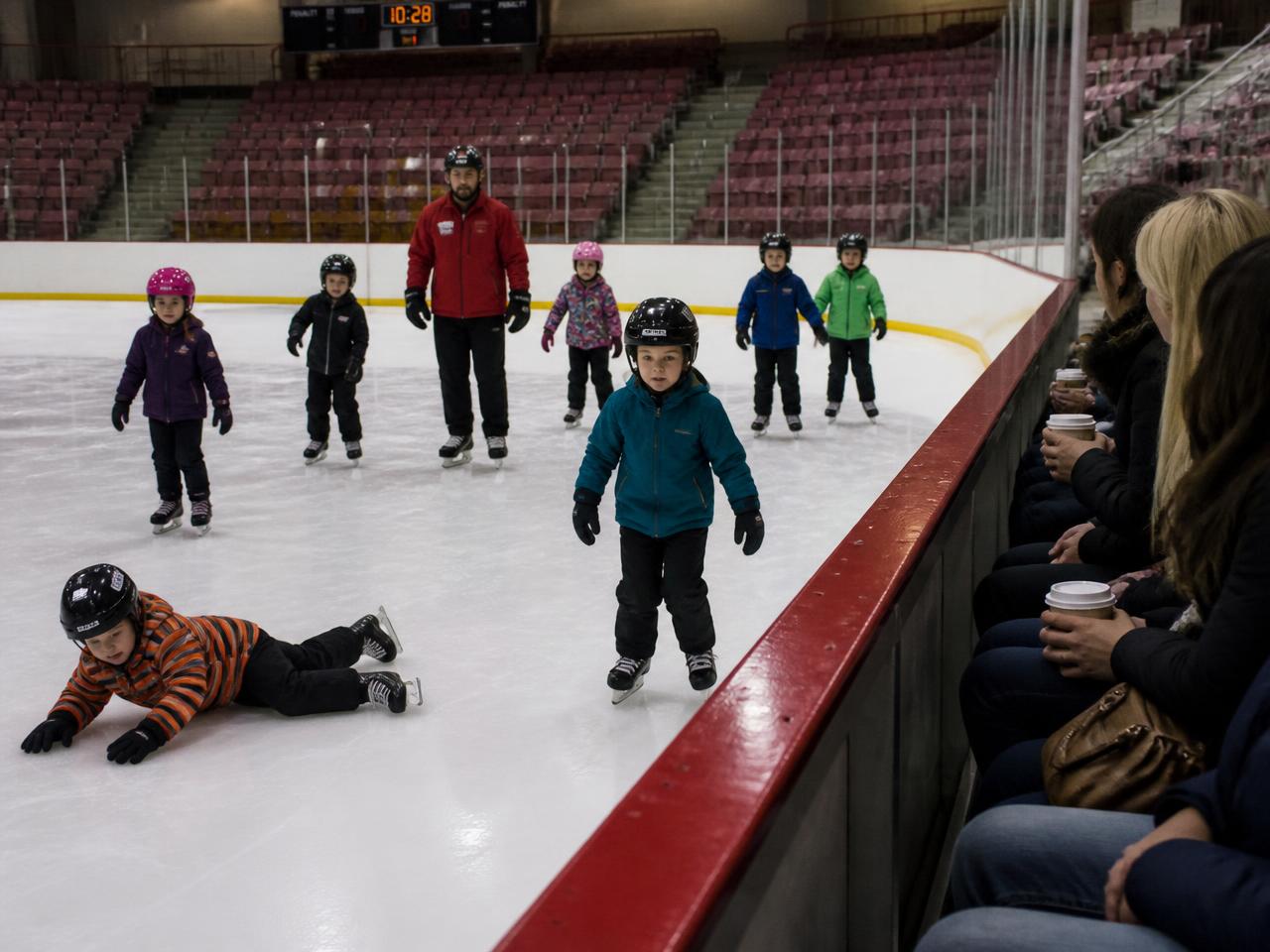 CELPIP Speaking Task 3 scene: an indoor ice rink during a skating lesson
